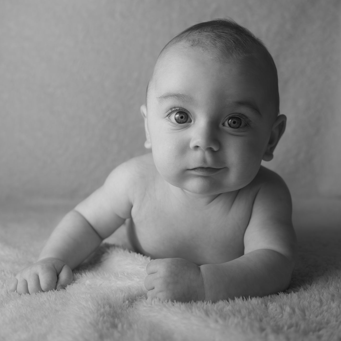 Infant resting peacefully in a soft nursery setting
